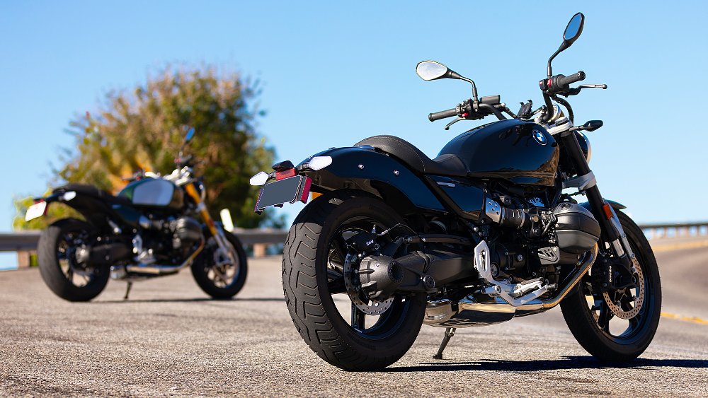 The R 12 and a cafe racer-styled R 12 nineT resting on the side of a mountain road.