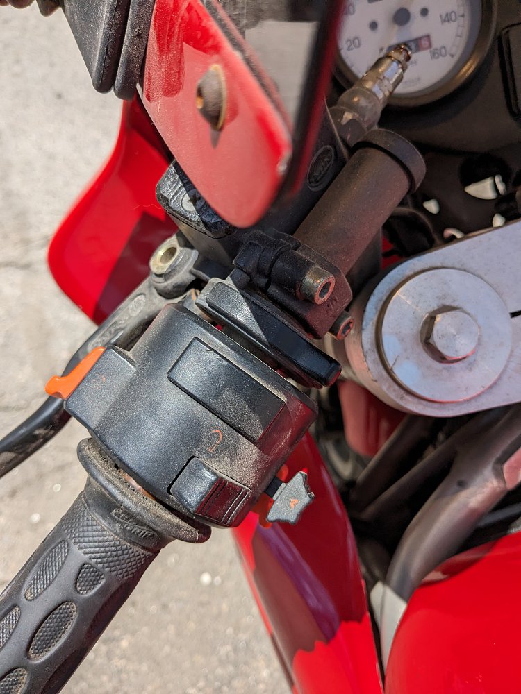 close photo of dusty lefthand switchgear on the Ducati