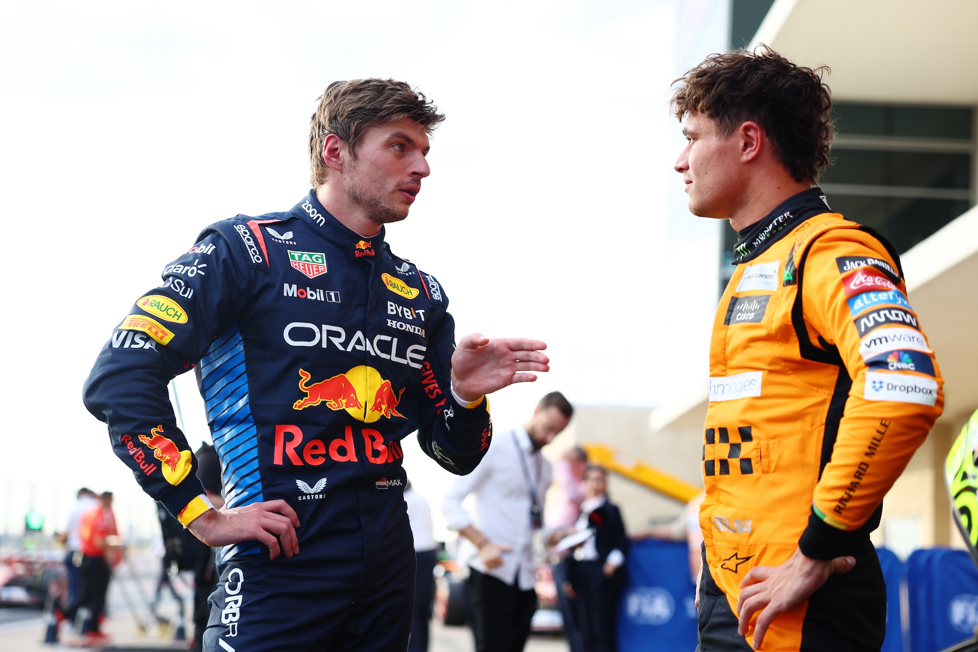 AUSTIN, TEXAS - OCTOBER 19: Pole position qualifier Lando Norris of Great Britain and McLaren talks with Second placed qualifier Max Verstappen of the Netherlands and Oracle Red Bull Racing in parc ferme during qualifying ahead of the F1 Grand Prix of United States at Circuit of The Americas on October 19, 2024 in Austin, Texas. (Photo by Bryn Lennon - Formula 1/Formula 1 via Getty Images)