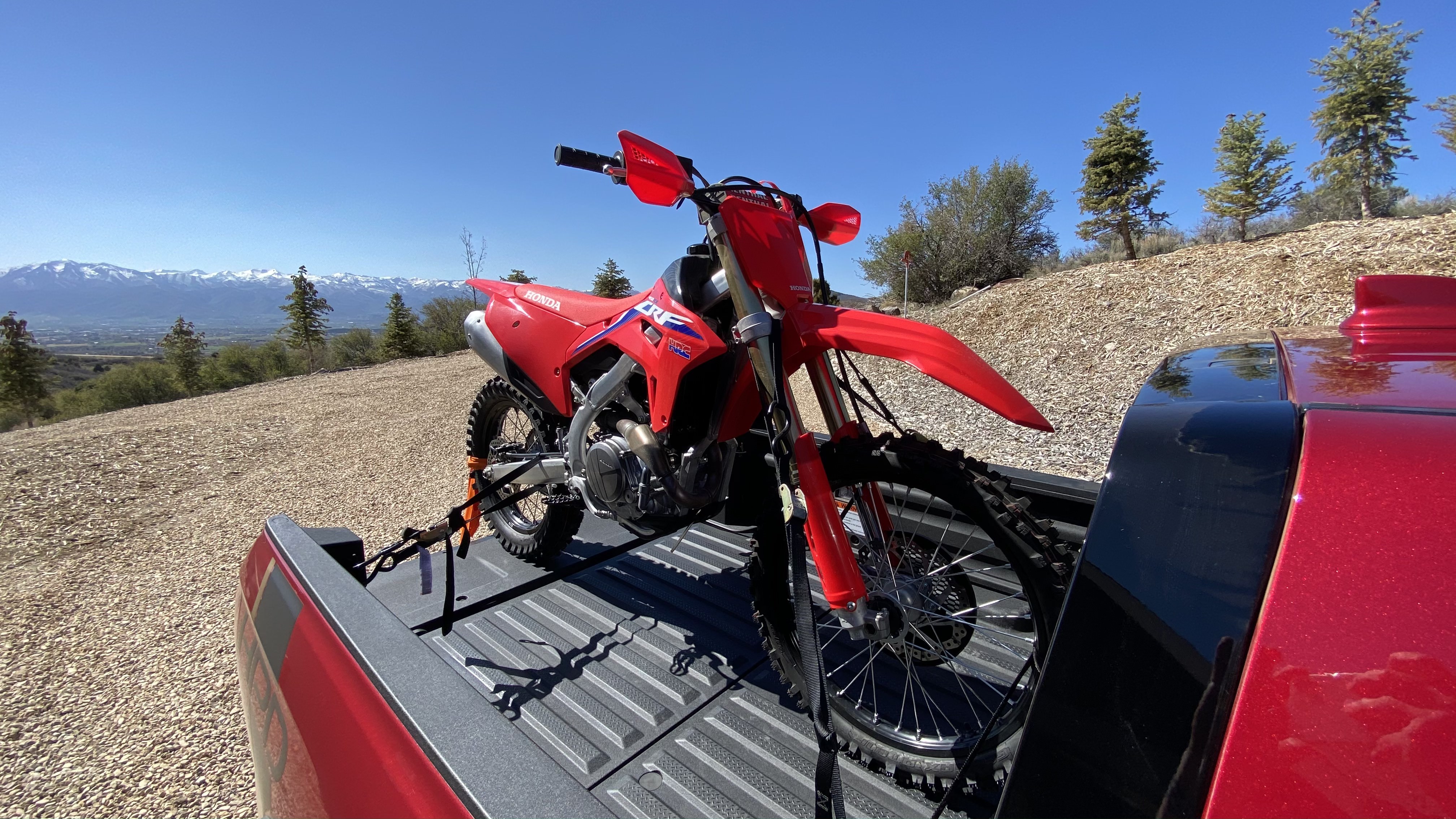 A closeup shot of the CRF450RX in the pickup's bed. 